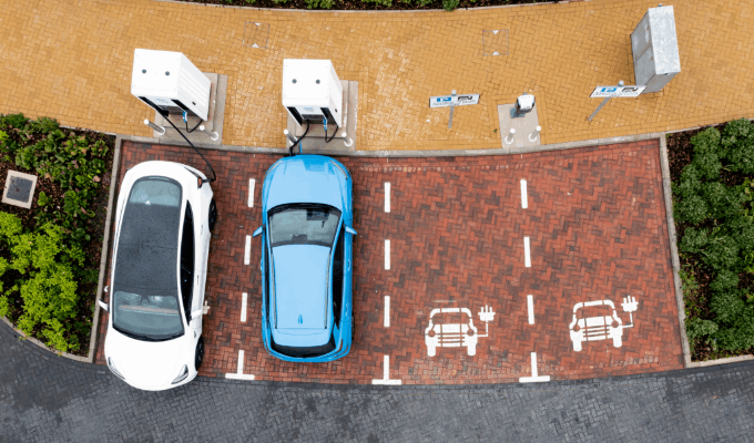 two cars parked up and charging
