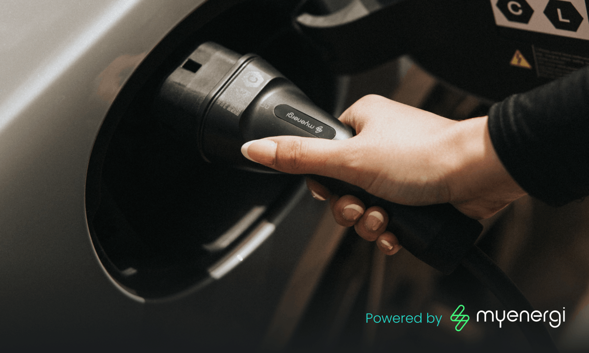 hand plugging in myenergi electric vehicle home charger